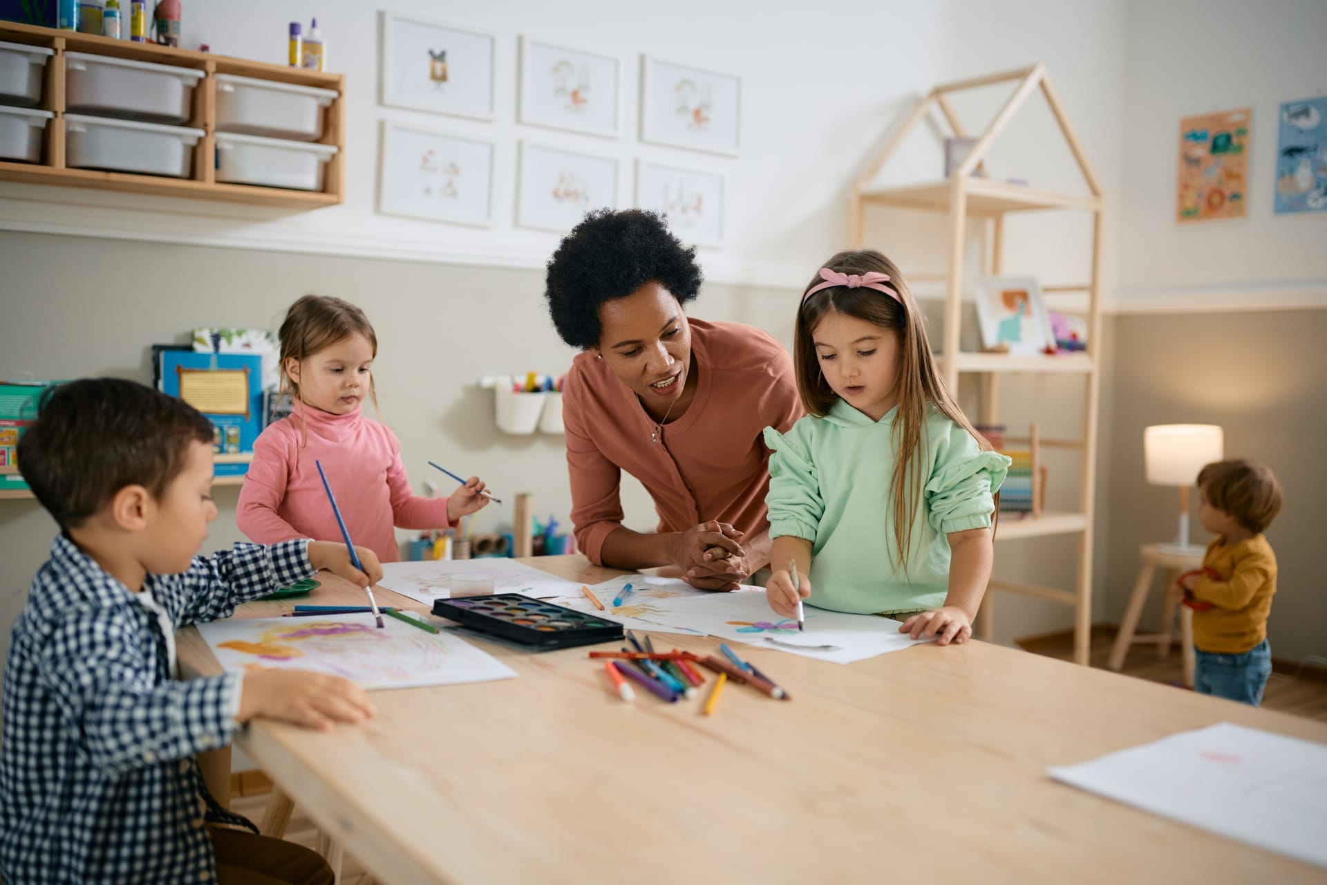 Teacher working with a group of homeschool children
