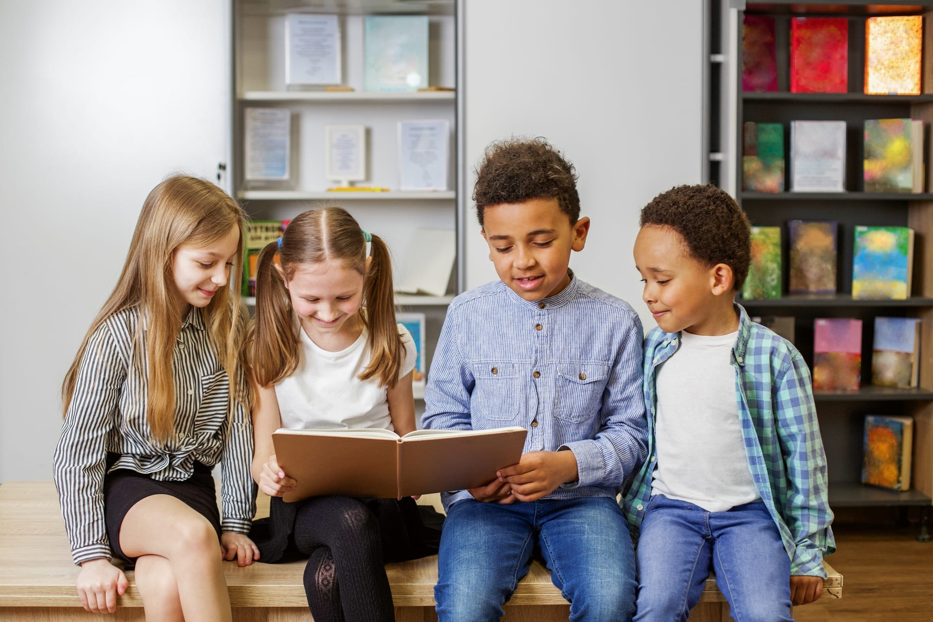Children reading together while following daily homeschool lesson guides